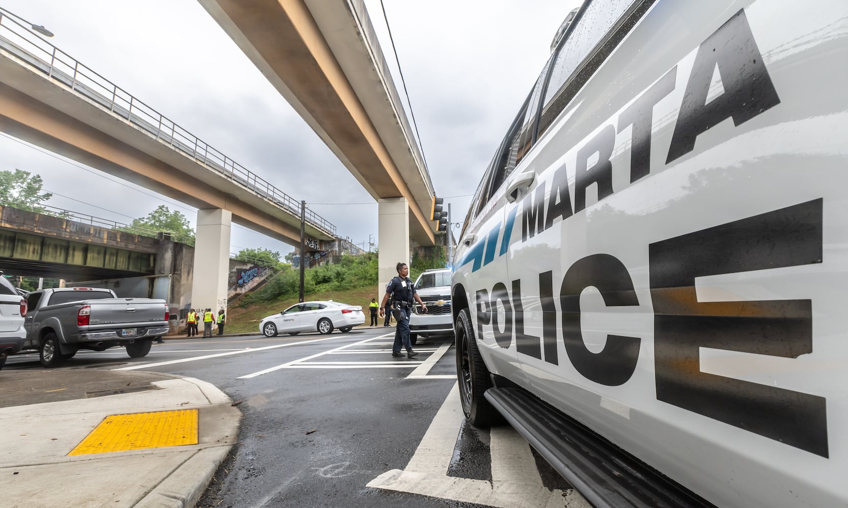 MARTA police and the Fulton County Medical Examiner’s office were on the scene of Rocky Ford Road and the MARTA train tracks investigating a death that shut down a section of track in Atlanta’s Kirkwood neighborhood after a suspected trespasser was hit and killed Thursday morning, June 6, 2024 by a westbound train. (John Spink/AJC)