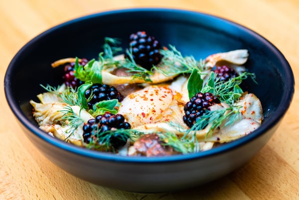 The White Bull in Decatur serves polenta with a duck egg, chanterelles, blackberries and green tomato. CONTRIBUTED BY HENRI HOLLIS