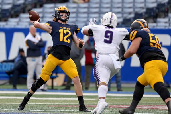 Prince Avenue Christian quarterback Brock Vandagriff (12) attempts a pass in the first half against Trinity Christian during the Class 1A Private championship at Center Parc Stadium Monday, December 28, 2020 in Atlanta, Ga.. JASON GETZ FOR THE ATLANTA JOURNAL-CONSTITUTION



