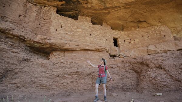 FILE - This July 15, 2016, file photo, U.S. Interior Secretary Sally Jewell tours the "Moonhouse" in McLoyd Canyon in Bears Ears National Monument near Blanding, Utah. President Donald Trump's call to review over two dozen national monuments established by three former presidents puts in limbo protections on large swaths of land home to ancient cliff dwellings, towering Sequoias, deep, canyons and oceans habitats where seals, whales and sea turtles roam. (AP Photo/Rick Bowmer, File)