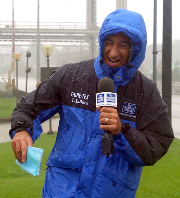 021003-LAFAYETTE, LA.-Weather Channel meteorologist Jim Cantore (cq) broadcasts an update on hurricane Lili while bracing against the wind-driven rain Thursday morning in Lafayette, La. (BEN GRAY/STAFF)