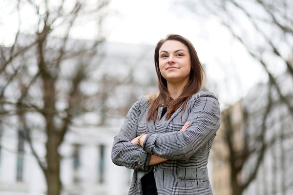 The Atlanta Journal-Constitution's City Hall reporter Riley Bunch poses for a photograph outside of Atlanta City Hall on Thursday, Feb. 23, 2023. (Miguel Martinez/AJC)