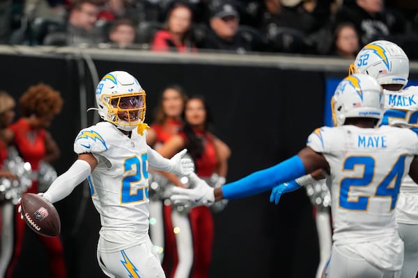 Los Angeles Chargers cornerback Tarheeb Still (29) celebrates after a pick six during the second half of an NFL football game against the Atlanta Falcons on Sunday, Dec. 1, 2024 in Atlanta. (AP Photo/Mike Stewart)