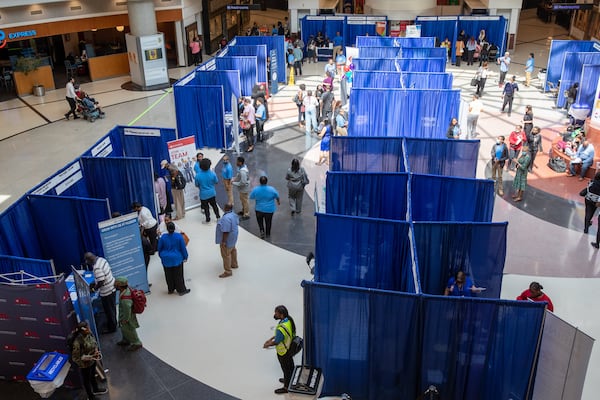 Potential job-seekers stroll through the domestic terminal atrium during the ATL Airport Career Fair at Hartsfield-Jackson Atlanta International Airport last week. (Steve Schaefer / steve.schaefer@ajc.com)