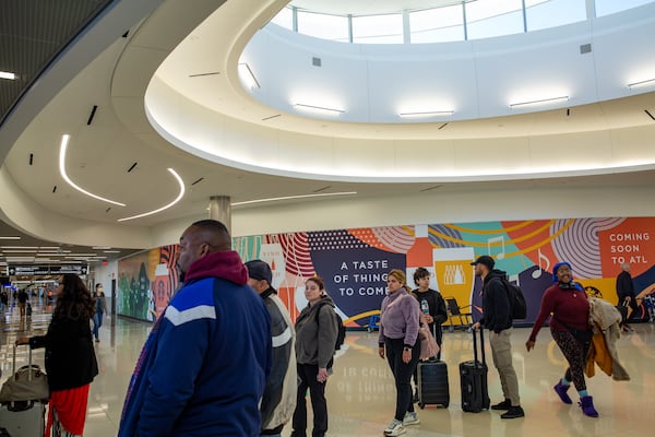 Hartsfield-Jackson Atlanta International Airport expands for the first time in a decade with the addition of five passenger gates on Concourse T.  Updated signage shows the addition of gates T17 - T21 on Thursday, Nov 17, 2022.  The area's circular atrium skylight, lounge seating options, large windows and digital information boards provide for United passengers.  (Jenni Girtman for The Atlanta Journal-Constitution)