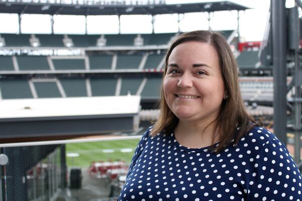 Katie Hearn began to lose her vision over a year ago. She was diagnosed with pseudotumor cerebri, a rare disorder. Now blind, she rebuilt her skills so she could still do her job in the social media department for the Atlanta Braves, which often means making games better for fans at SunTrust Park. JENNA EASON / JENNA.EASON@COXINC.COM