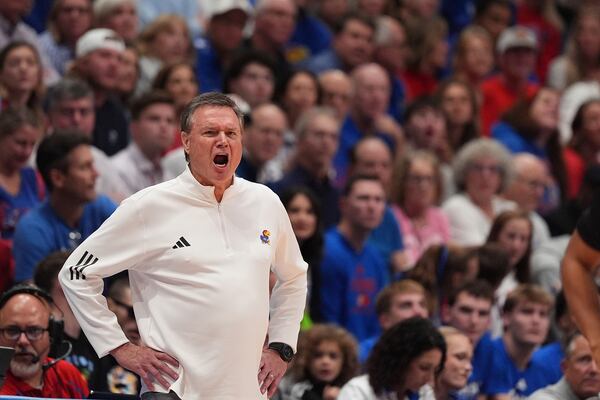 Kansas head coach Bill Self talks to his players during the second half of an NCAA college basketball game against North Carolina Friday, Nov. 8, 2024, in Lawrence, Kan. Kansas won 92-89. (AP Photo/Charlie Riedel)