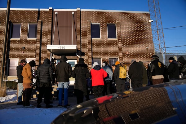 People gather for a prayer vigil outside a United States Customs and Immigration Enforcement detention facility Friday, Feb. 21, 2025, in Broadview, Ill. (AP Photo/Erin Hooley)