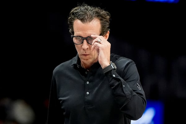 Atlanta Hawks head coach Quin Snyder walks on the court during the first half of an NBA basketball game against the Miami Heat, Monday, Feb. 24, 2025, in Atlanta. (AP Photo/Mike Stewart)