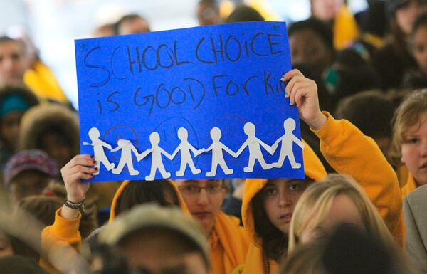 110125 Atlanta: Signs were everywhere Tuesday during the rally. Hundreds of parents and students attended the School Choice Celebration and Rally at the Georgia State Capitol Tuesday, Jan. 25, 2011. The gathering rallied to push state lawmakers to expand educational options for Georgia families. The event joined together unlikely allies, public and private school leaders in a display of unity where they urged lawmakers to expand scholarship opportunities so parents can better afford to pick their children's schools. Private schools want the state to raise the $50 million cap on the tax-credit scholarship that has helped hundreds of public school students transfer to private schools. Charter school officials want the state to support the continued funding of their campuses, which faces a state Supreme Court challenge from a handful of Georgia public school systems. The rally comes as the country celebrates National School Choice Week. David Pusey, director of a Center for an Educated Georgia, said more metro Atlanta parents appear to be concerned about choice than ever before, especially with accreditation problems at Atlanta Public Schools. John Spink jspink@ajc.com A state Supreme Court ruling today means the program that provides tax exemptions to those who contribute to scholarships for students to use at private schools, including religious schools, will remain in place.