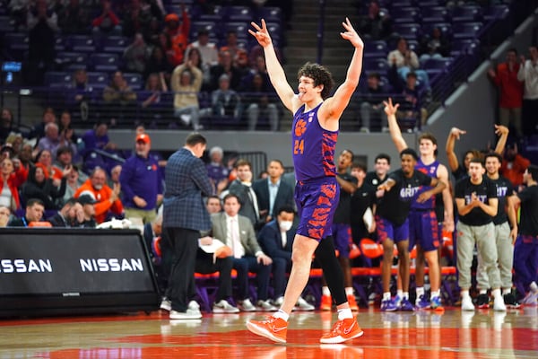 Clemson center PJ Hall celebrates a three pointer by a teammate during the first half of an NCAA college basketball game against Georgia Tech Tuesday, Jan. 24, 2023, in Clemson, S.C. (AP Photo/Sean Rayford)