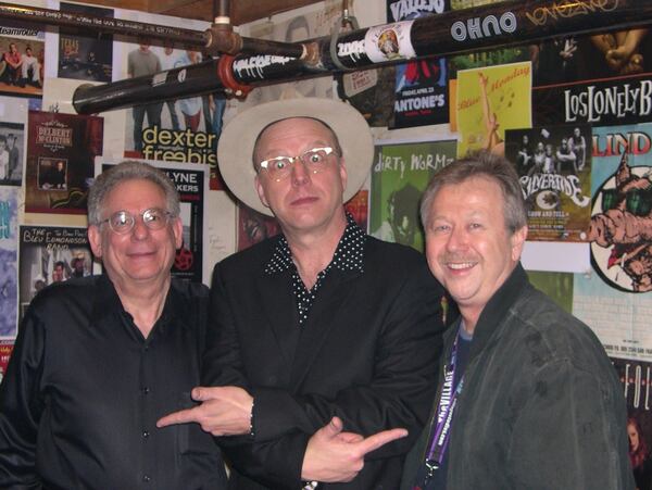 Michael Rothschild (from the left) founder of Landslide Records, poses in his office with rockabilly artist Webb Wilder and publicist Mark Pucci. Landslide captured Atlanta’s rock and roots music history on vinyl. Photo: courtesy Landslide Records