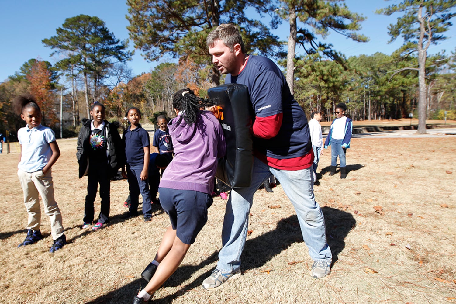 SEC stars build football field in DeKalb