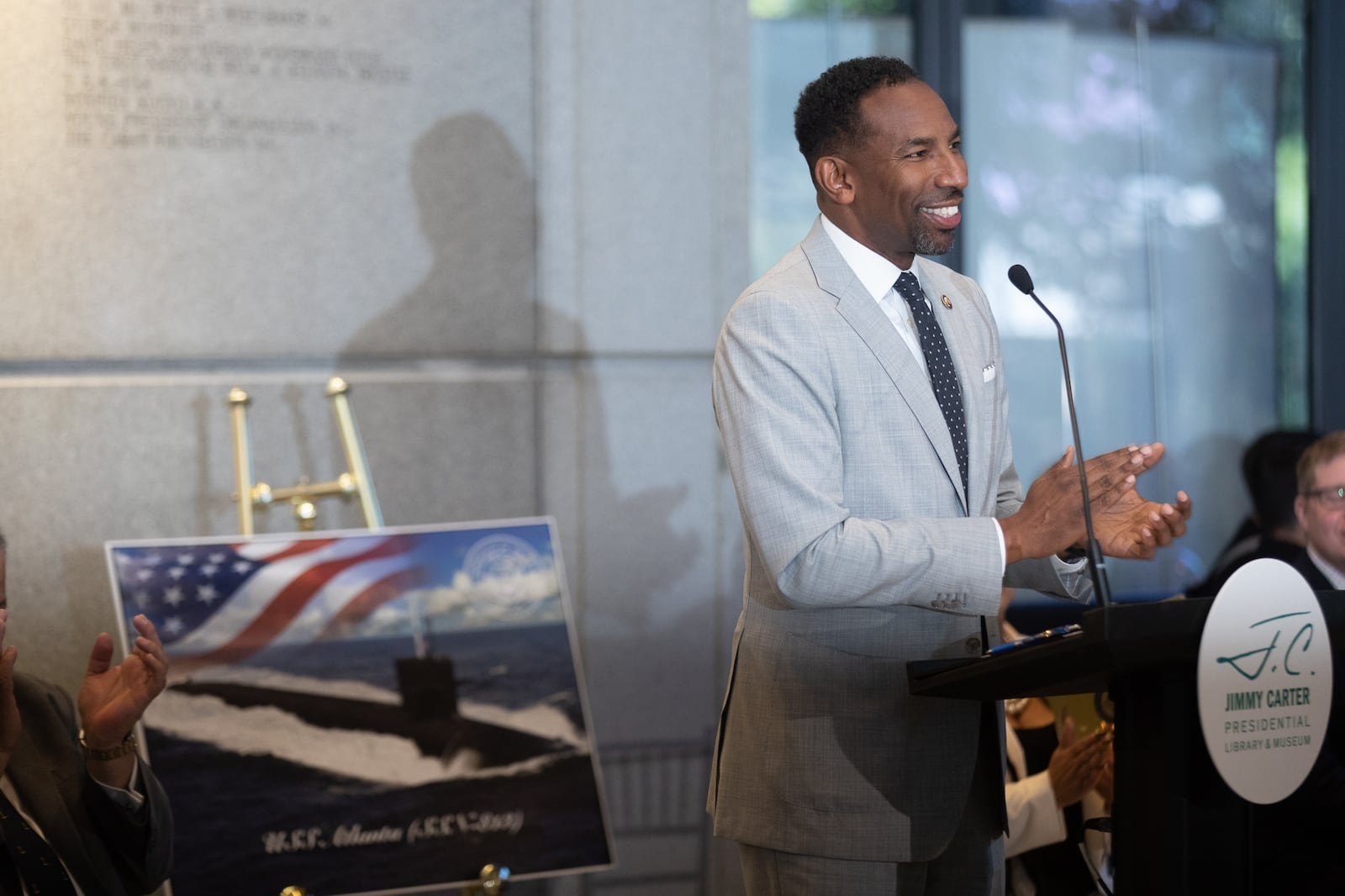 Atlanta Mayor Andre Dickens celebrates the U.S. Navy's newest Virginia-class nuclear-powered submarine named the "U.S.S. Atlanta" during a ceremony at the Jimmy Carter Presidential Library and Museum on Oct. 23, 2024.