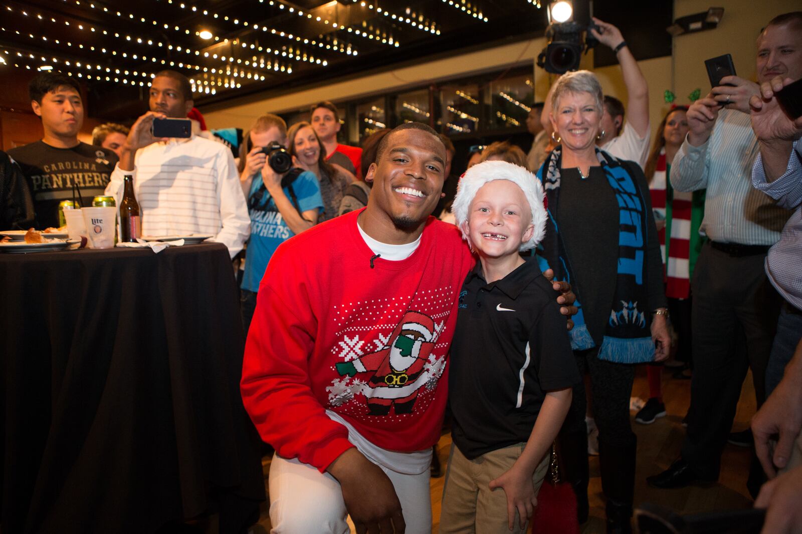 All this young man wants for Christmas are his two front teeth.... and a visit from Santa Cam! All photos: Cam Newton Foundation/Andreas Seibold.