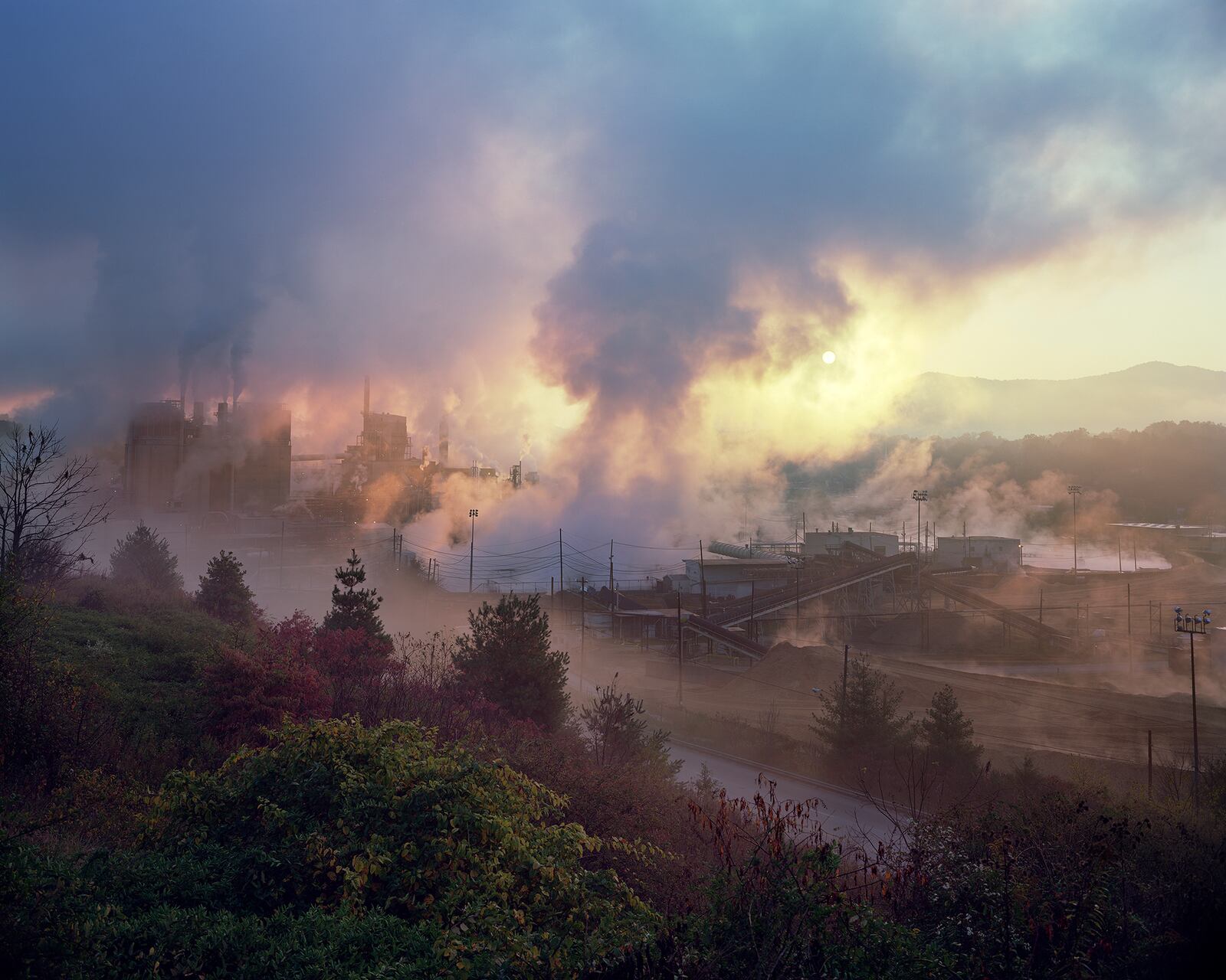 The exhibition of Southern photography "Reckonings and Reconstructions" at the Georgia Museum of Art  in Athens features an array of images of the region including Jeff Rich's sinister, lovely vision “Blue Ridge Paper Mill, The Pigeon River, Canton, North Carolina,” (2008).
(Courtesy of Georgia Museum of Art)