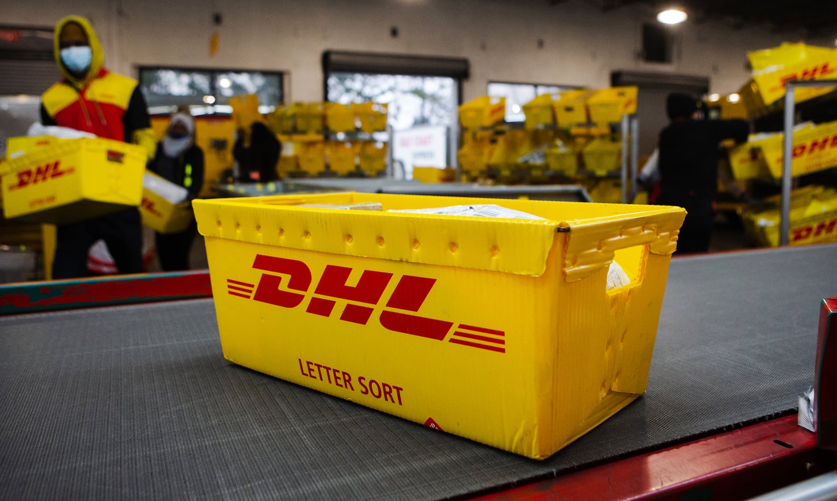 A bos of DHL packages is prepared to be shipped on Wednesday, December 16, 2020, at DHL Express in Atlanta. Workers at the shipping center worked to fulfill orders during the holiday rush. CHRISTINA MATACOTTA FOR THE ATLANTA JOURNAL-CONSTITUTION.