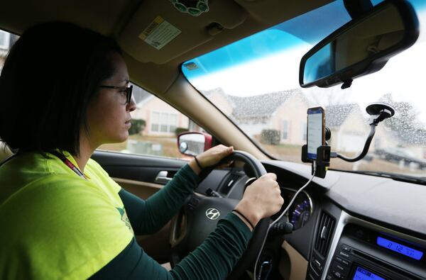 2/22/19 - Norcross - Michelle Sanchez with the New Georgia Project Action Fund drives to canvass in support of the MARTA referendum on Friday, February 22, 2019 in Norcross, Georgia. Early voting for the referendum begins on February 25. The election is March 19. The New Georgia Project Action Fund have already knocked on thousands of doors and don’t plan to slow down anytime soon. EMILY HANEY / emily.haney@ajc.com