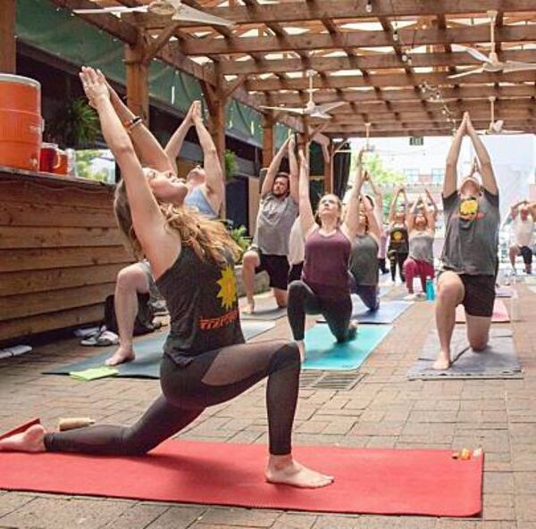 People perform yoga at a previous Innercise Yoga event.