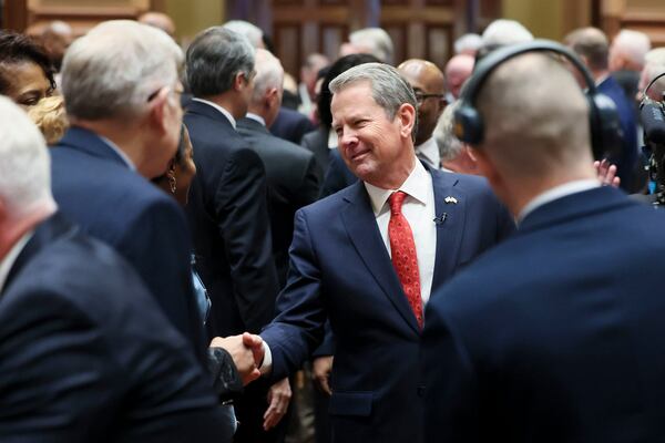 Gov. Brian Kemp greets lawmakers before Thursday's state of the state address.