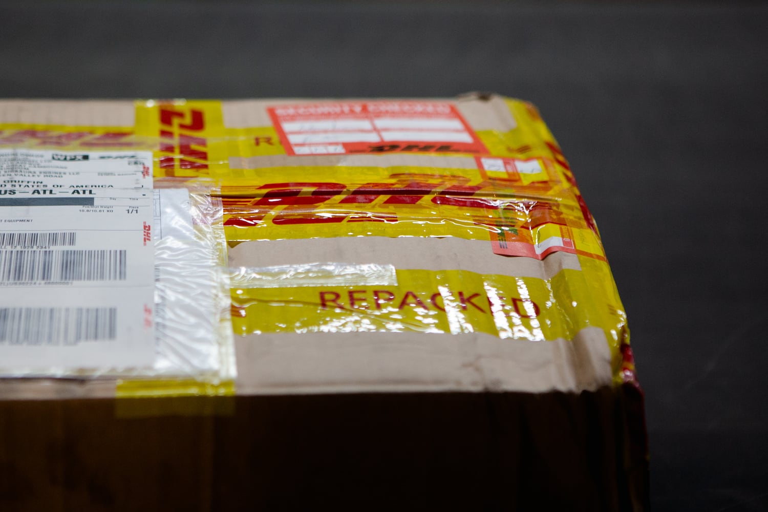 A DHL package is prepared to be shipped on Wednesday, December 16, 2020, at DHL Express in Atlanta. Workers at the shipping center worked to fulfill orders during the holiday rush. CHRISTINA MATACOTTA FOR THE ATLANTA JOURNAL-CONSTITUTION.