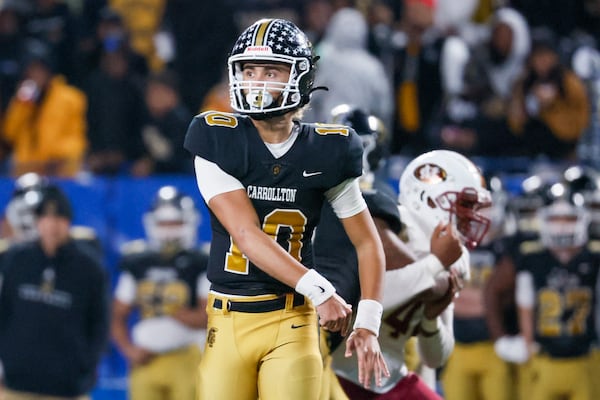 Carrollton quarterback Julian Lewis (10) attempts a pass during the second half against Mill Creek in the GHSA Class 7A finals, at Center Parc Stadium, Saturday, December 10, 2022, in Atlanta. Mill Creek defeated Carrollton 70-35. Carrollton freshman quarterback Julian Lewis threw for a state championship game record 531 yards and five touchdowns. (Jason Getz / Jason.Getz@ajc.com)