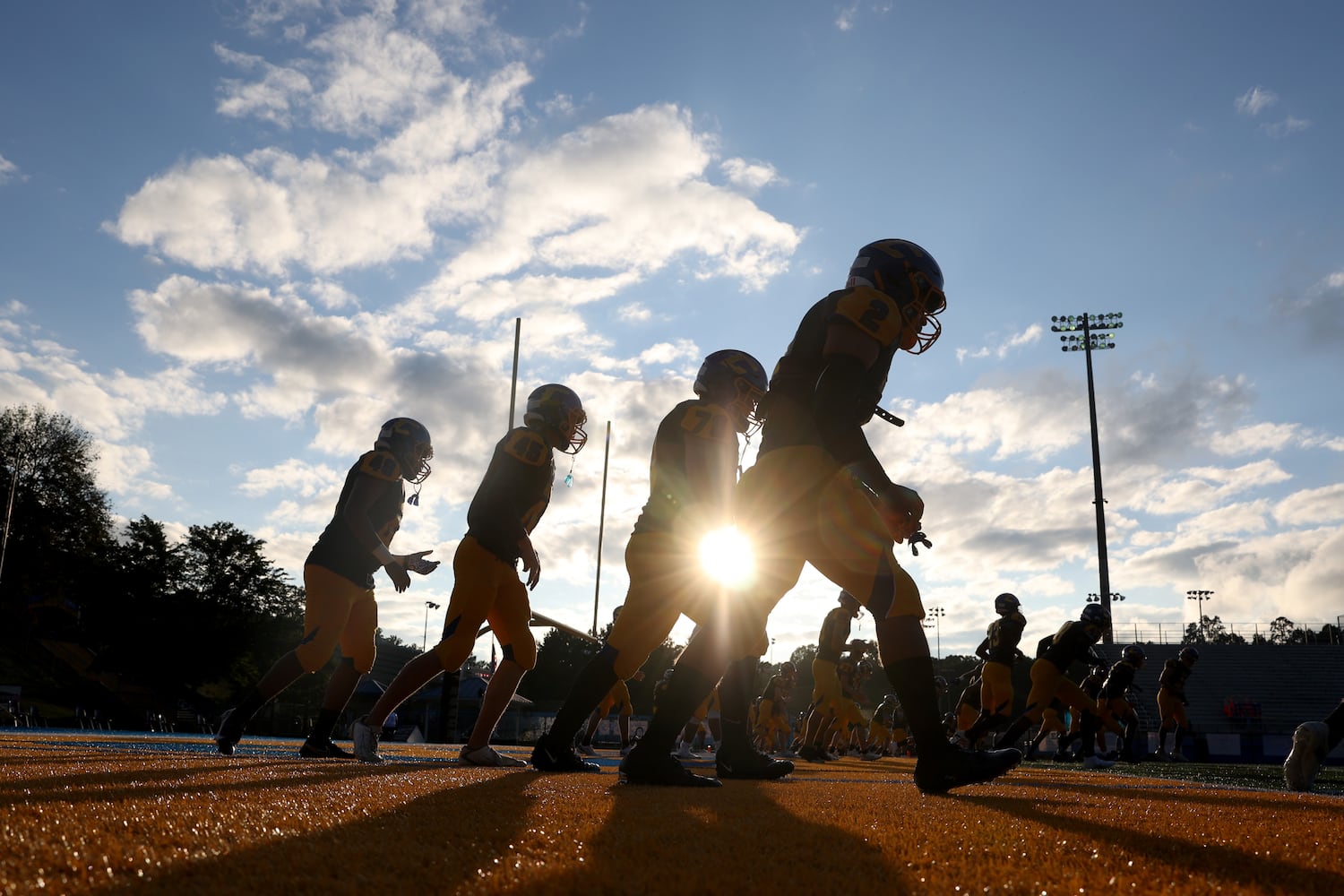 Chattahoochee football players warm-up before their game against Alpharetta at Chattahoochee high school Friday, September 25, 2020 in Johns Creek, Ga.. JASON GETZ FOR THE ATLANTA JOURNAL-CONSTITUTION