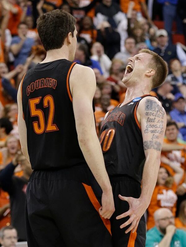 Mercer forward Jakob Gollon celebrates a basket with Mercer forward Daniel Coursey (52) during the second half of an NCAA college basketball second-round game against Duke, Friday, March 21, 2014, in Raleigh, N.C. Mercer won 78-71. (AP Photo/Gerry Broome) The Bears are still dancing. (Gerry Broome/AP photo)