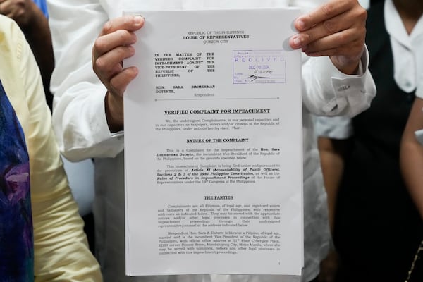 A received copy of an impeachment complaint filed Monday, Dec. 2, 2024 against Philippine Vice President Sara Duterte by several prominent opponents and activists at the House of Representatives in Quezon City, Philippines. (AP Photo/Aaron Favila)