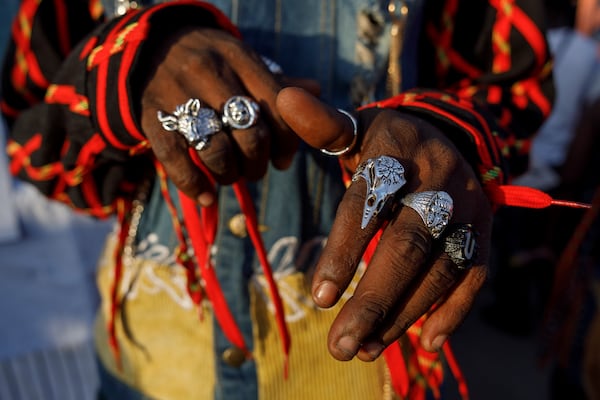 A model shows thrift rings during a thrift and an upcycle show in Accra, Ghana, Sunday, Oct. 27, 2024. (AP Photo/Misper Apawu)