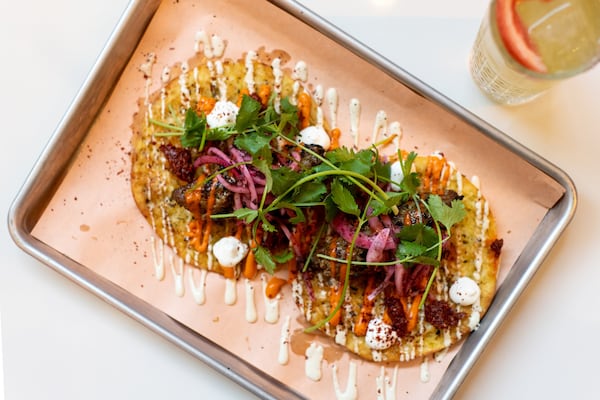 Beef Kebab with garlic pita, tomato brown butter, and sumac onion. Photo credit- Mia Yakel.