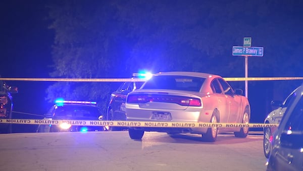 Atlanta and campus police blocked off the area outside the library on James P. Brawley Drive near Beckwith Street after the shooting Tuesday night. 