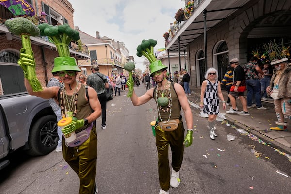 People dress as broccoli during the Society of Saint Anne's parade on Mardi Gras Day, Tuesday, March 4, 2025 in New Orleans. (AP Photo/Gerald Herbert)