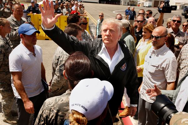 President Donald Trump and first lady Melania arrive at Muniz Air National Guard Base in Carolina, Puerto Rico on Oct. 3, 2017, almost two weeks after Hurricane Maria hit the island. (Carolyn Cole/Los Angeles Times/TNS)