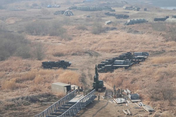 U.S. Army soldiers prepare to cross the Hantan river at a training field in Yeoncheon, South Korea, near the border with North Korea, Monday, March 10, 2025. (AP Photo/Ahn Young-joon)