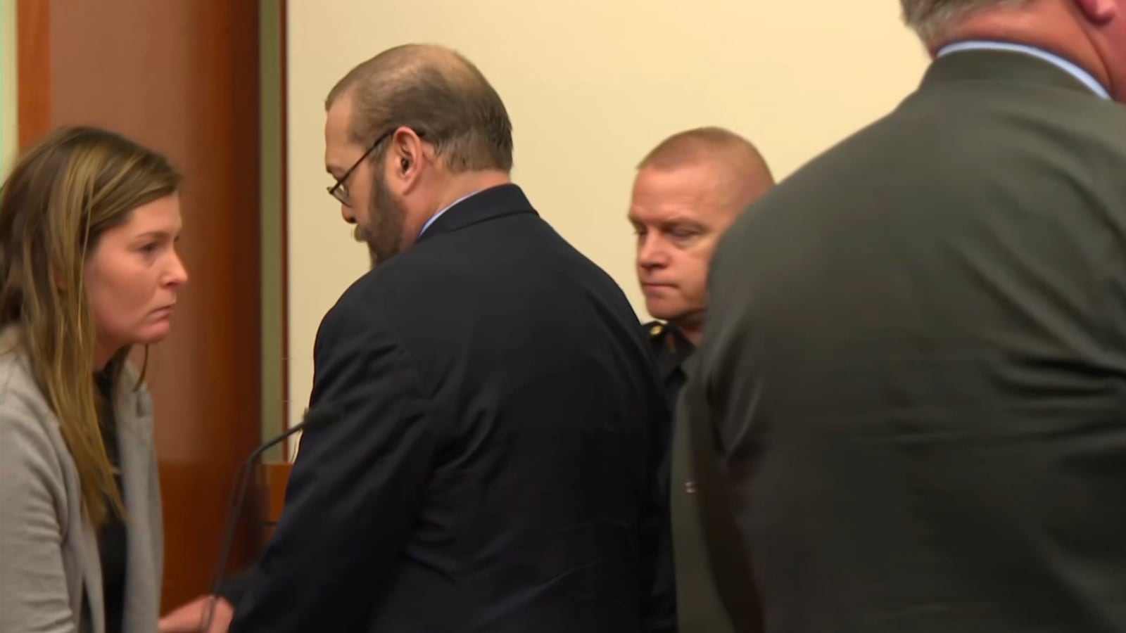 In this image from video, former police officer Adam Coy, second right, leaves the courtroom in Columbus, Ohio, on Monday, Nov. 4, 2024, after he was convicted of murder in the shooting of Andre Hill, a Black man who was holding a cellphone and keys when he was killed. (WSYX/WTTE via AP, Pool)