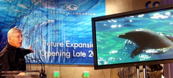 Aquarium founder Bernie Marcus announces plans for the dolphin exhibit during a press conference at the Georgia Aquarium on Tuesday.