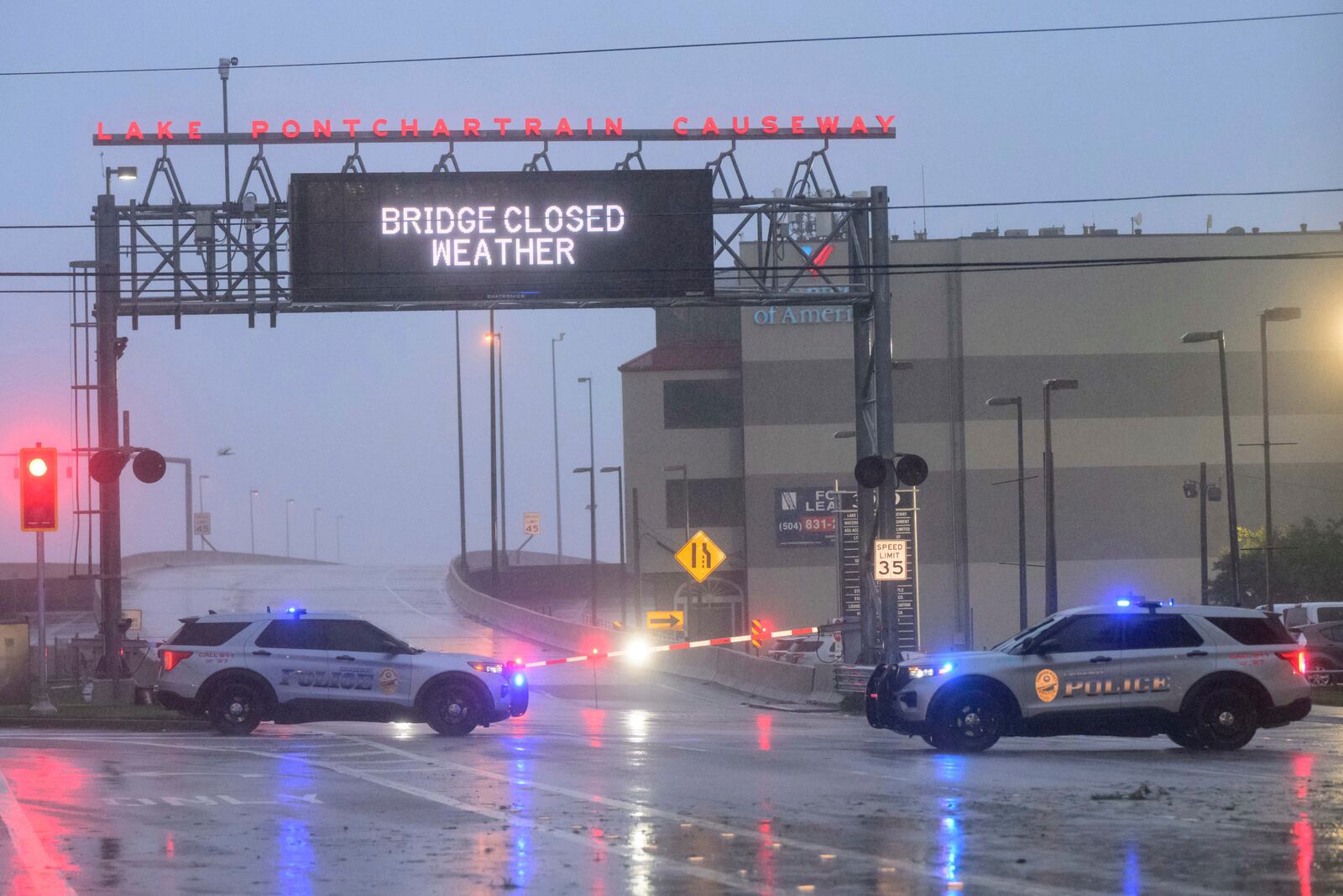 The entrance to Lake Ponchartrain Causeway is closed due to Hurricane Francine in Metairie, La., Wednesday, Sept. 11, 2024. The causeway is the longest continuous bridge over water in the world. (AP Photo/Matthew Hinton)