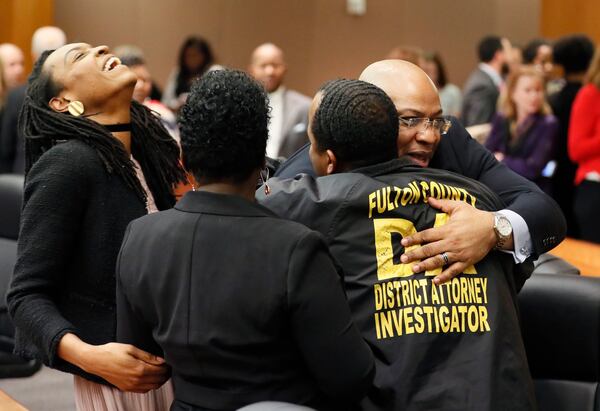 4/23/18 - Atlanta - Chief Assistant District Attorney Clint Rucker (right) is congratulated after the verdict.  The jury found Tex McIver guilty on four of five charges on their fifth day of deliberations today at the Tex McIver murder trial at the Fulton County Courthouse.   Bob Andres bandres@ajc.com