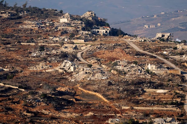 Destroyed buildings in the village of Kfar Kila, southern Lebanon, are seen from northern Israel, Tuesday, Dec. 3, 2024. (AP Photo/Maya Alleruzzo)