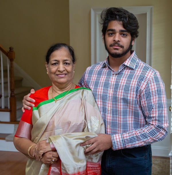 Westminster School senior Azeez Ishaqui (right) poses with his grandmother Najma in their Smyrna home. During the pandemic Azeez came up with an idea to have women from India sew face masks that he would donate to homeless shelters in metro Atlanta. HIs Grandmother helped him accomplish that with her connections there. He was a high school freshman when he started helping the poor in India, first providing carts for men selling goods, and then later providing sewing machines for widows so they could earn a living. His parents are both from India, and he has always been encouraged to help the poor there.  PHIL SKINNER FOR THE ATLANTA JOURNAL-CONSTITUTION.