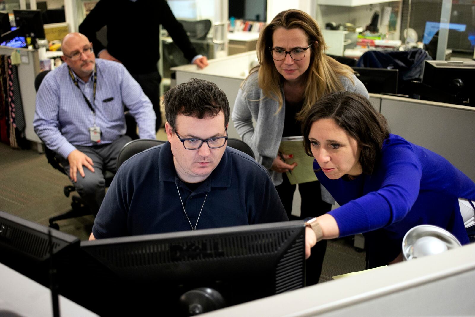 FILE - In this Feb. 5, 2020, photo Associated Press Washington Bureau Chief Julie Pace, right, looks over a headline with deputy managing editor for operations David Scott in the newsroom at the Associated Press in Washington. (AP Photo/Jenny Kane, File)