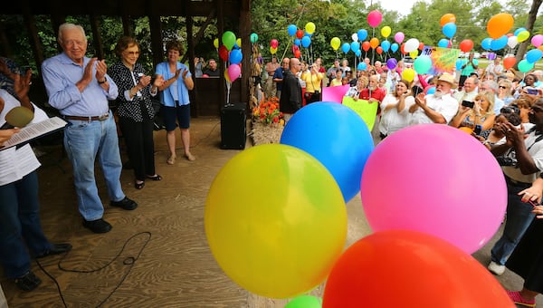 Former President Jimmy Carter and former first lady Rosalynn Carter applaud along with the crowd after Mayor L.E. Godwin finishes reading a birthday proclamation during the President's 90th birthday party at Maxine Reese Park on Sunday, Sept. 28, 2014, in Plains, Georgia. CURTIS COMPTON / CCOMPTON@AJC.COM