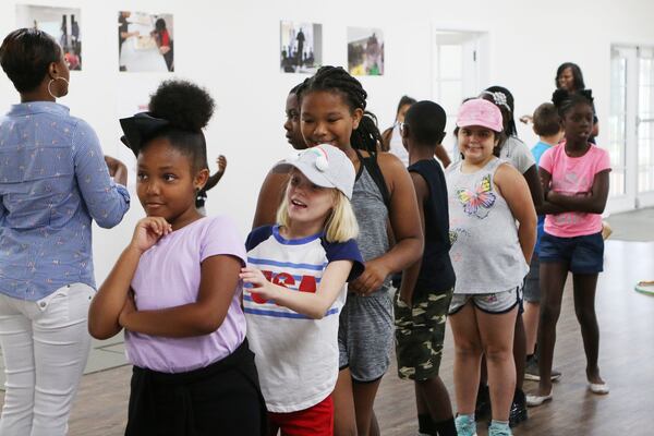 June 5, 2019 Cobb County: Jolli (left), Elizabeth Eastman and Aliceson Lewis (third) lead the line to go outside during the ‘Water is Life’ collaborative youth enrichment camp on Wednesday, Jun. 5, 2019, at the Austell Youth Innovation Center in Austell, Georgia. The goal of the Youth Innovation Center is to provide enrichment opportunities and improve graduation rates for youth in the surrounding community. The center opened on a site previously hit by the 2009 floods. (Christina Matacotta/christina.matacotta@ajc.com)