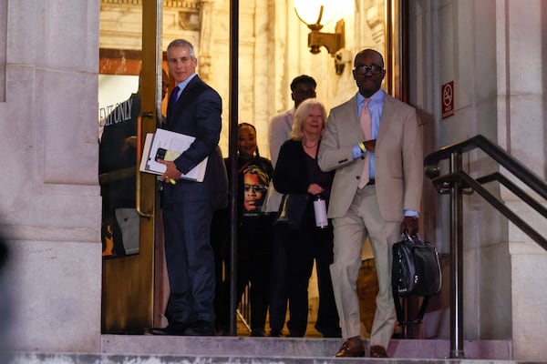 Dozens of Young Thug's supporters cheered Friday night as his defense team left the Fulton County Courthouse in Atlanta.
(Miguel Martinez / AJC)