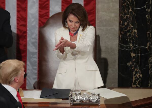 Speaker Nancy Pelosi applauds President Donald Trump during his the State of the Union address in the chamber of the U.S. House on Tuesday. Chip Somodevilla/Getty Images