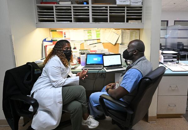 Dr. Keila Brown (left), vice president and chief health officer, confers with Dr. Dale Kesley Robertson at the Family Health Center at West End, Thursday, May 11, 2023, in Atlanta. The loss of hospital services at Atlanta Medical Center’s two locations in downtown and East Point is the subject of plans and discussion for both Atlanta and Fulton County elected officials. While leaders say they want new clinics and health facilities, existing clinics say they already reach out to the same people, offering care to the poor and uninsured.(Hyosub Shin / Hyosub.Shin@ajc.com)