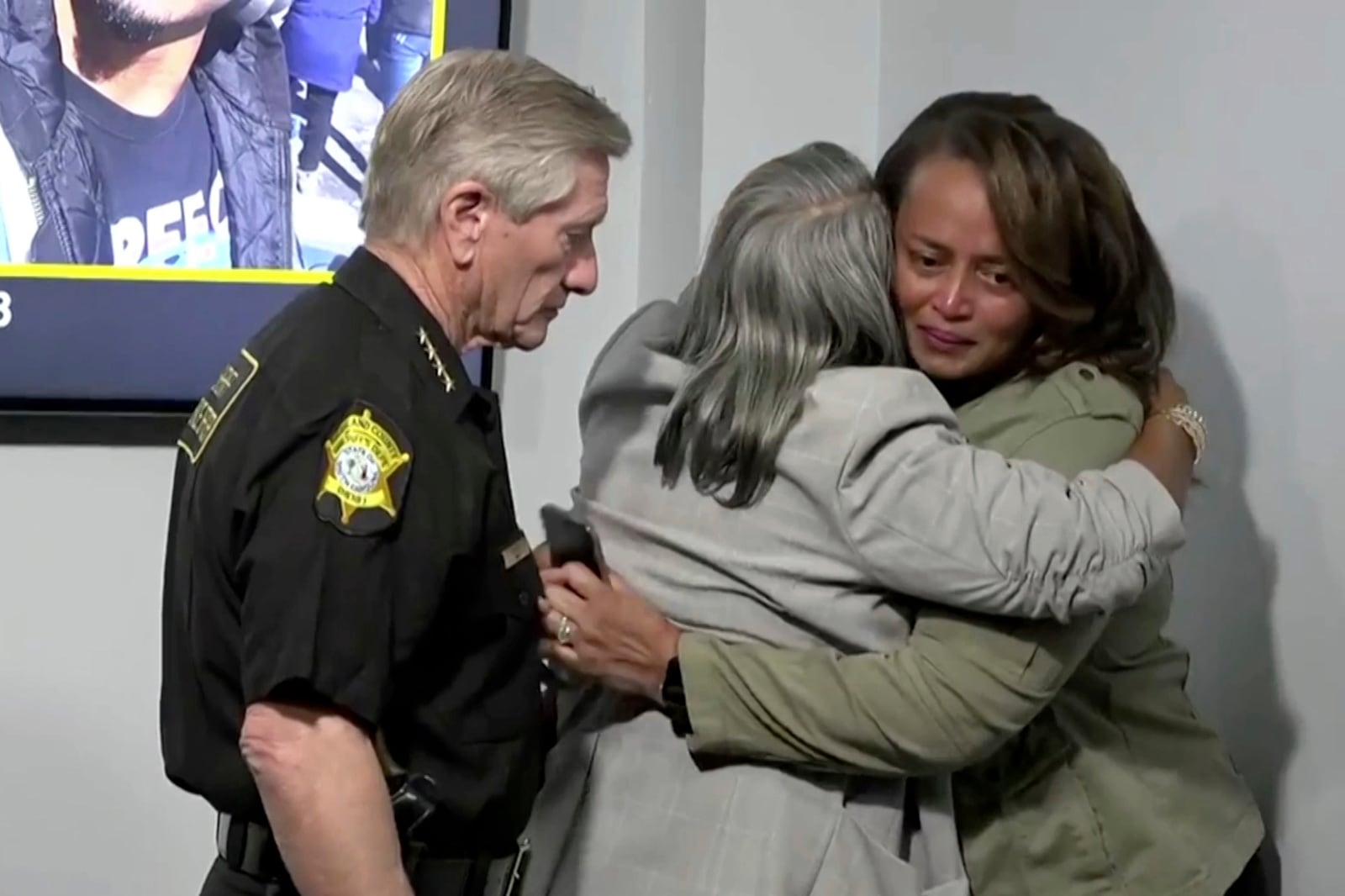 In this photo provided by Richland County Sheriff’s Office, Richland County Sheriff Leon Lott, left, stands next to Kathy Williams, middle, and Mieoki Corbett-Jacobs after discussing the search for 28-year-old Zelig Williams, a dancer who went missing on Oct. 3, after a news conference on Wednesday, Oct. 16, 2024 in Columbia, S.C. (Richland County Sheriff’s Office via AP)