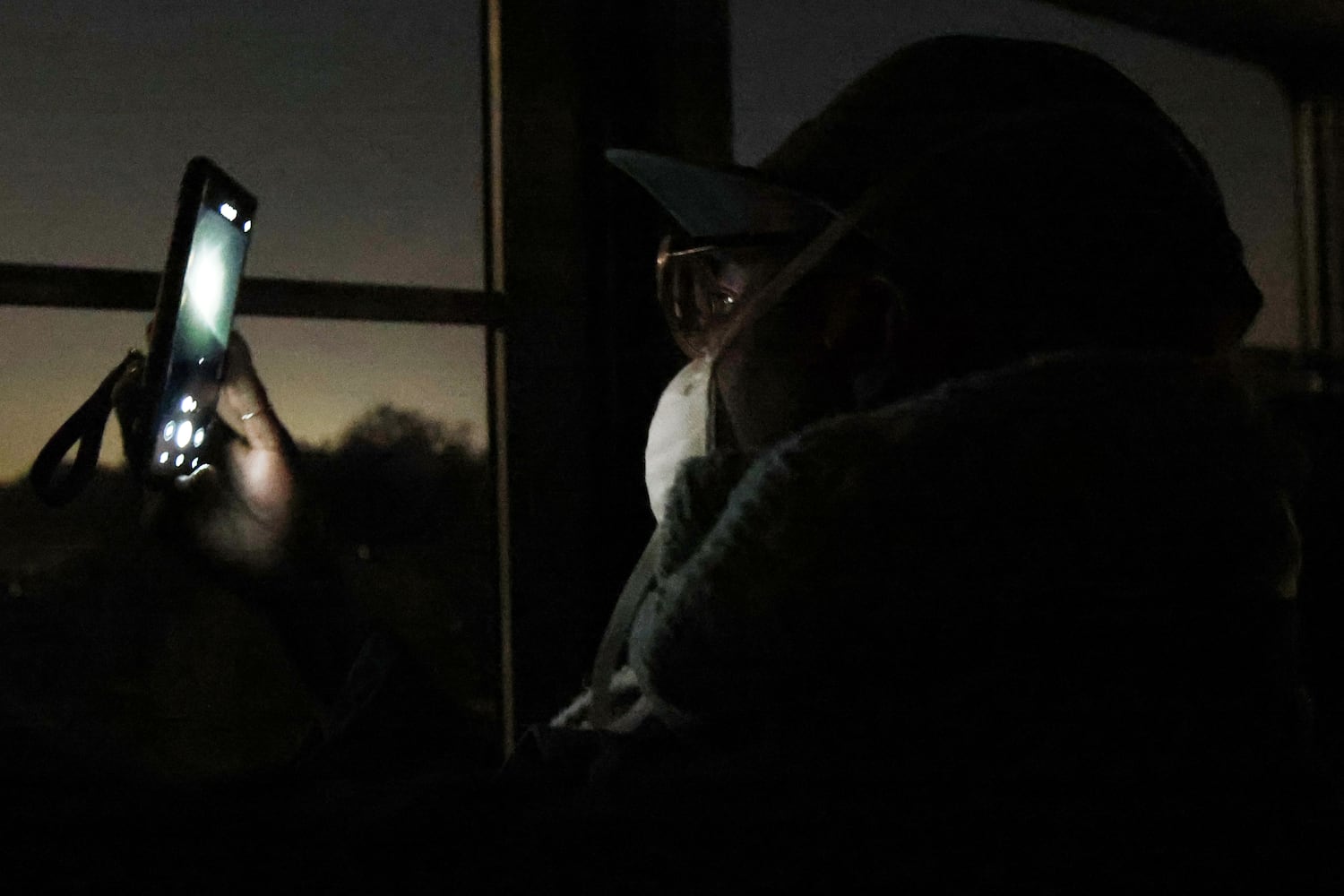 Donnette Cruickshank takes a photo of Stone Mountain as she rides the skylift before the start of the 76th annual Easter Sunrise Service on Sunday, April 17, 2022. Miguel Martinez/miguel.martinezjimenez@ajc.com