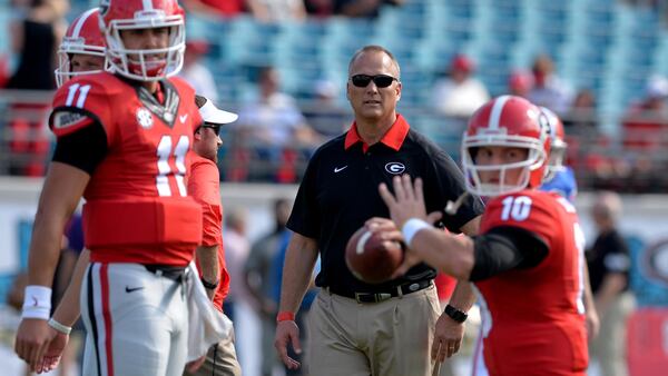 Georgia head coach Mark Richt watches  quarterback Faton Bauta  throw before the game against Florida in 2015 in Jacksonville, FL.  BRANT SANDERLIN/BSANDERLIN@AJC.COM